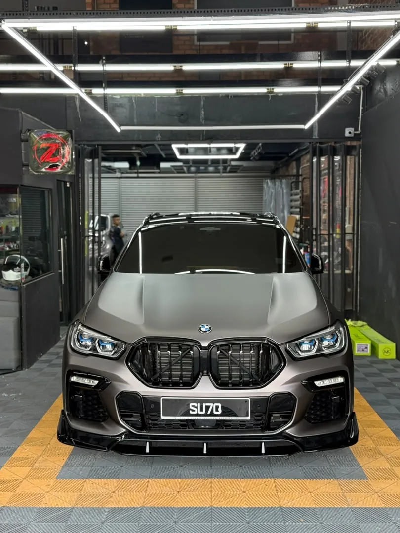 Front straight view of matte gunmetal wrap on a BMW X6 by Z-Sticker