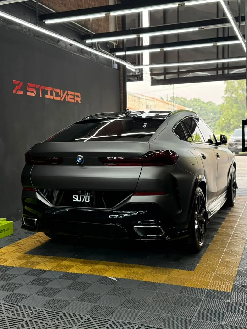 Rear view of matte gunmetal wrap on a BMW X6 by Z-Sticker