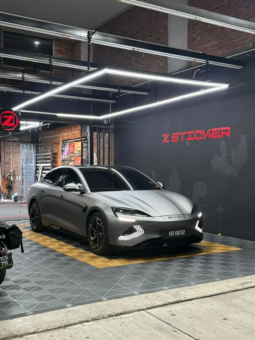 Rear angle of matte graphite wrap on an electric sedan by Z-Sticker