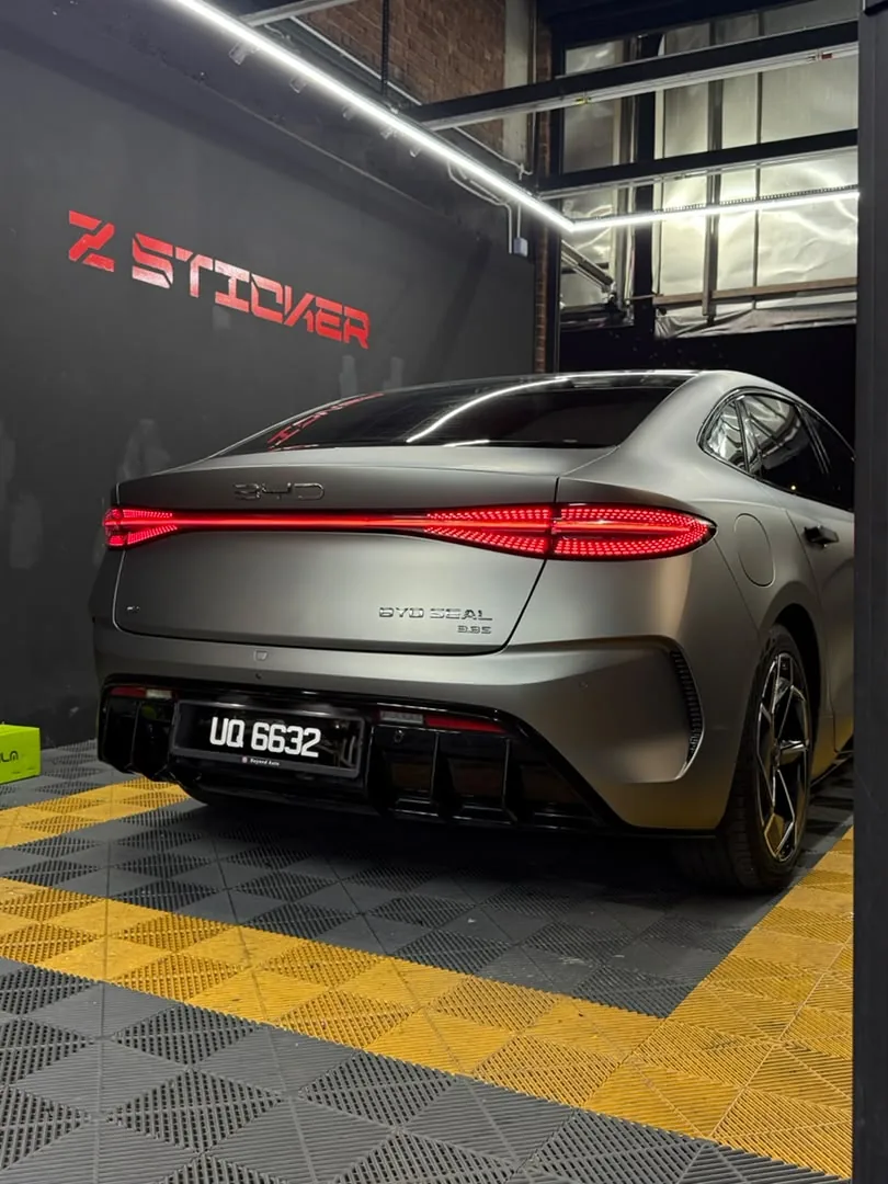 Rear view of matte graphite wrap on an electric sedan by Z-Sticker