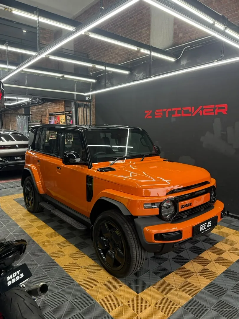 Close front angle of matte orange wrap on a Ford Bronco by Z-Sticker