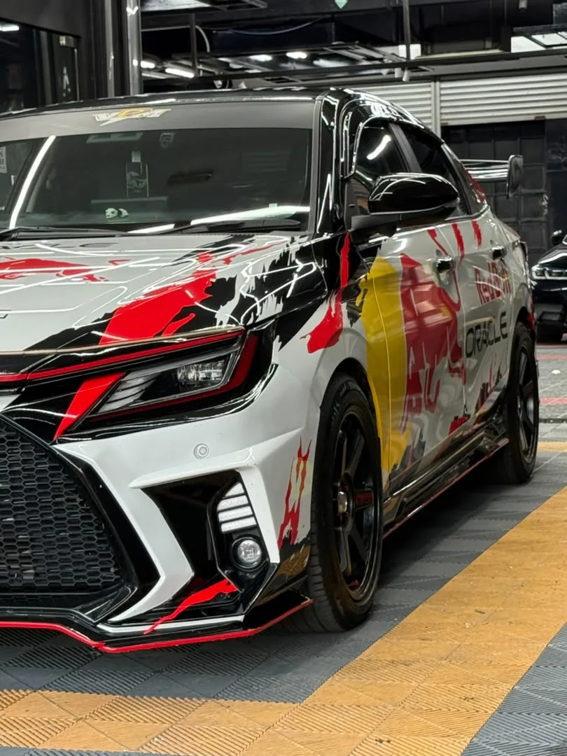 Red Bull Racing-inspired livery wrap on a Lexus coupe by Z-Sticker