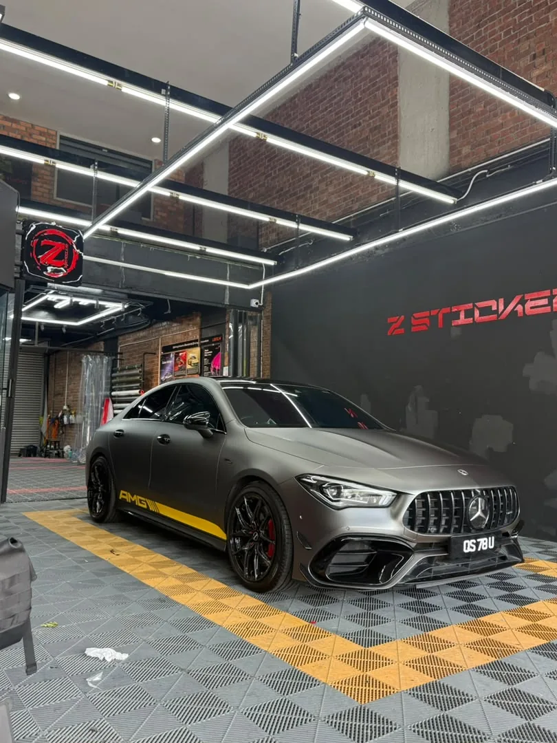 Side view of matte graphite wrap on a Mercedes-AMG CLA by Z-Sticker