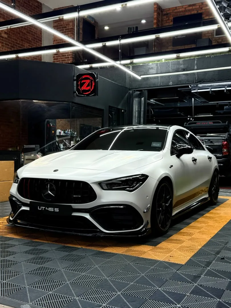 Side view of gloss white wrap on a Mercedes-AMG CLA by Z-Sticker