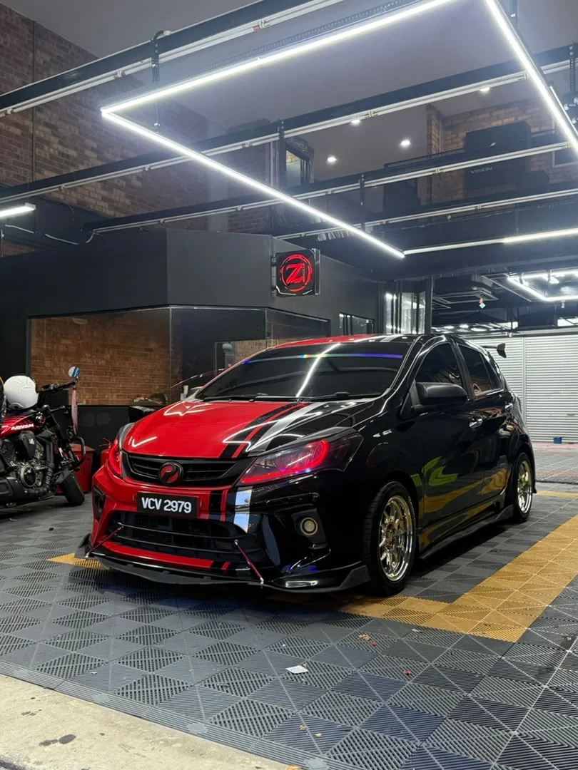 Black and red GR-style wrap on a Perodua Myvi by Z-Sticker