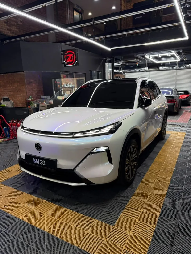 Pearl white wrap on a Proton electric SUV by Z-Sticker, Selangor