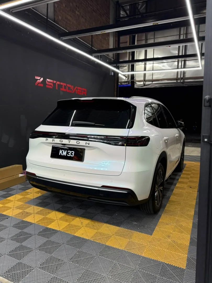 Rear view of pearl white wrap on a Proton electric SUV by Z-Sticker