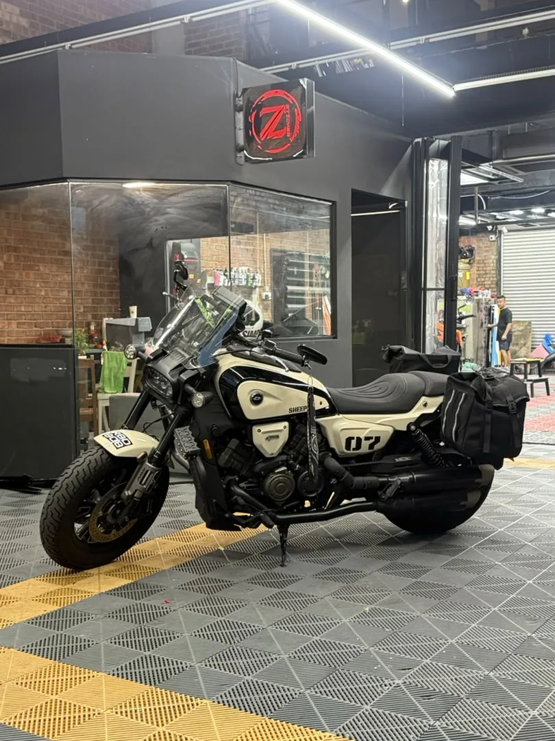 Side angle of cream and black wrap on a retro motorcycle by Z-Sticker