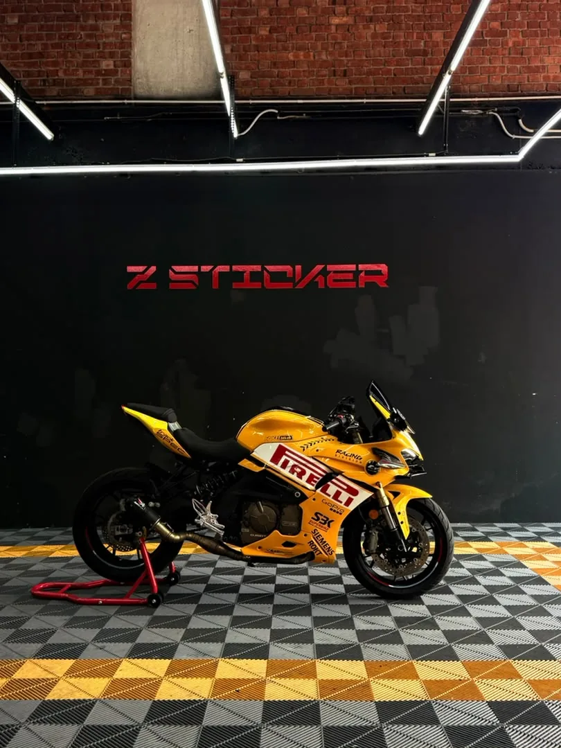 Side angle of yellow Pirelli racing wrap on a sportbike by Z-Sticker