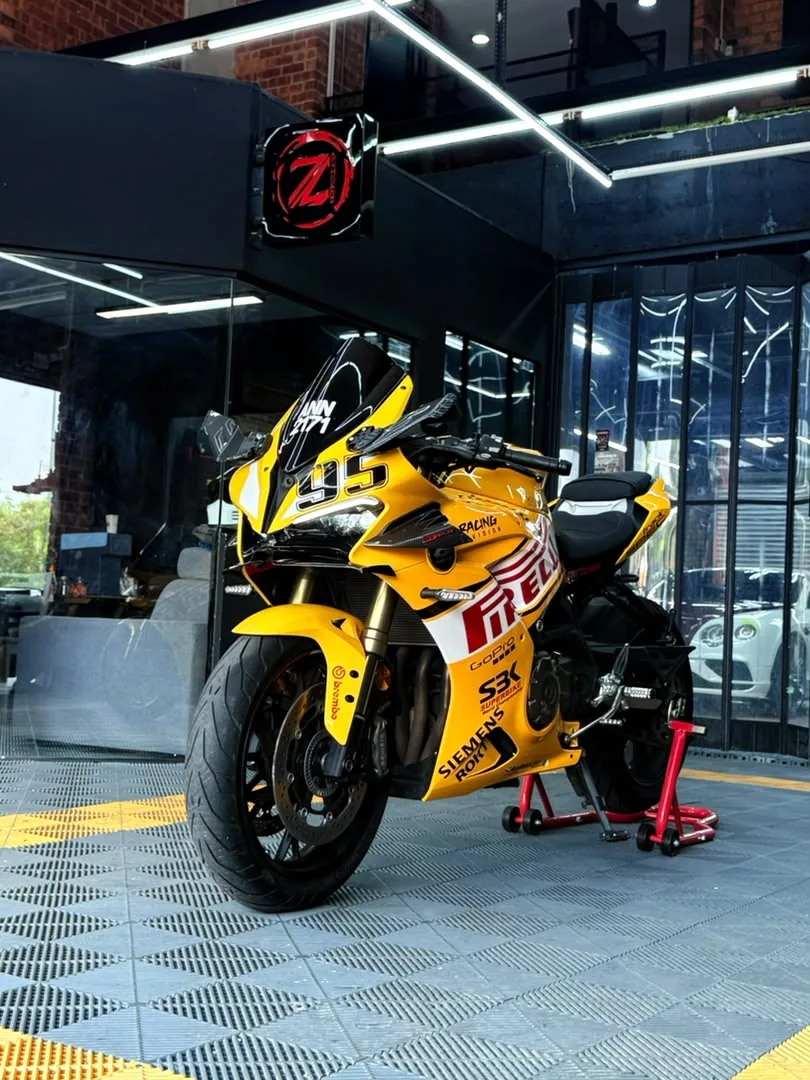 Yellow Pirelli-themed racing wrap on a sportbike by Z-Sticker