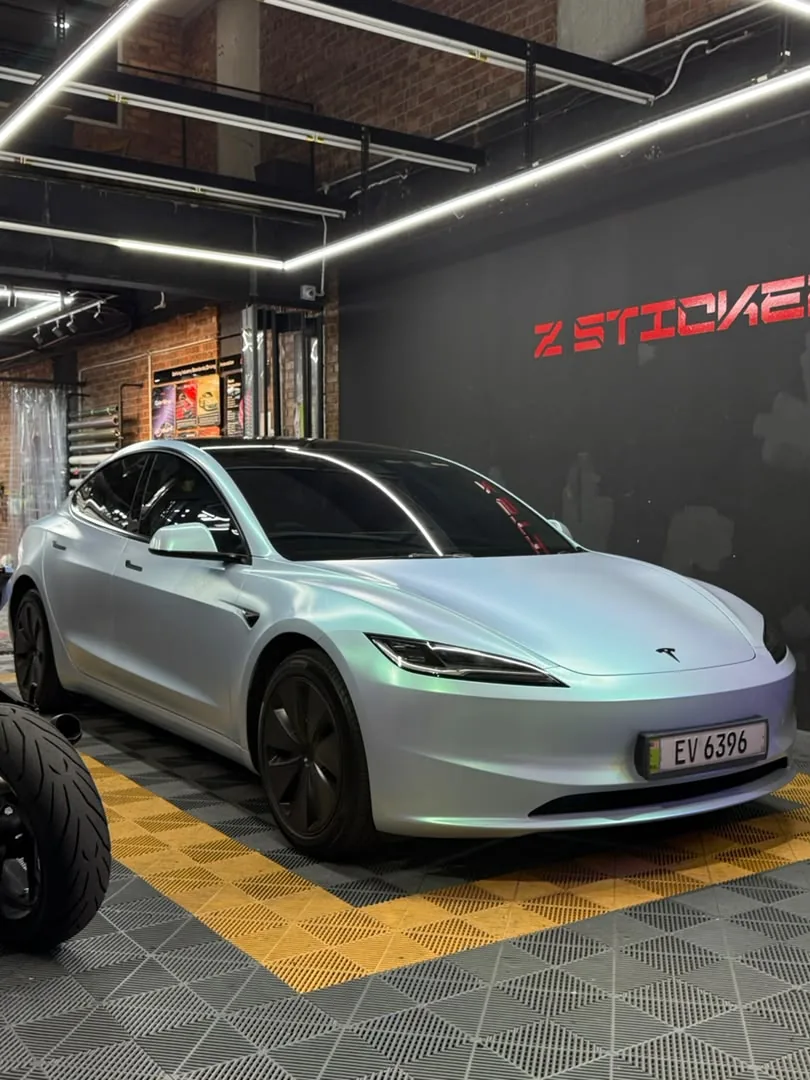 Front angle of pearl white wrap on a Tesla Model 3 by Z-Sticker