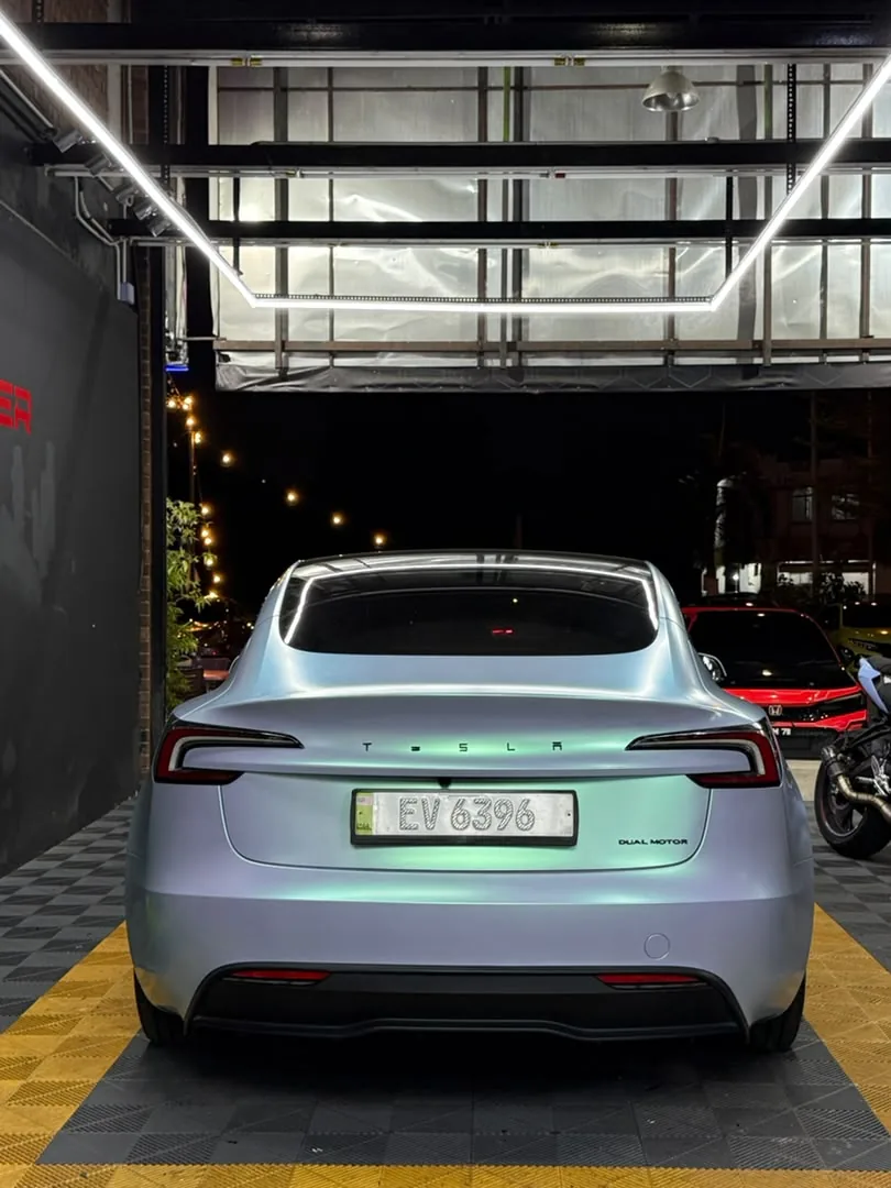 Rear view of pearl white wrap on a Tesla Model 3 by Z-Sticker