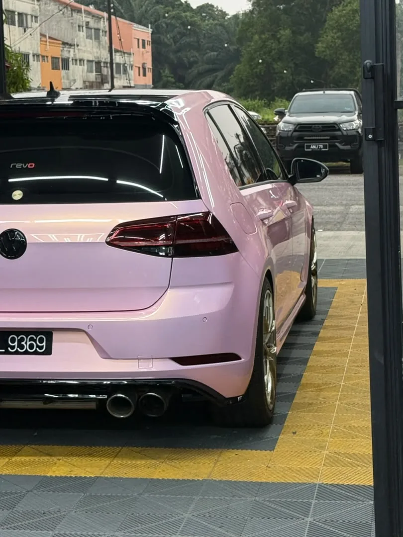 Rear view of gloss pink wrap on a Volkswagen Golf R by Z-Sticker